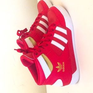 Gold, white, and red colored adidas